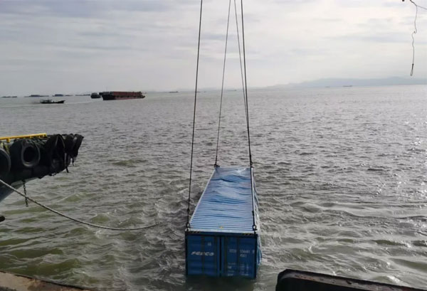 All three containers that fell into the water have been safely lifted back to the dock